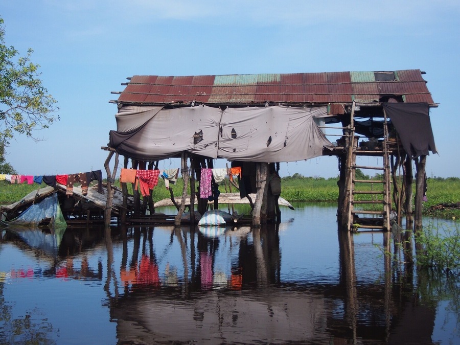 A typical house on the banks of the river on the way from Battambang to Siem Reap. GDP in Cambodia is only around $1,000 per annum but I expect it's rather less for many rural families - it looks idyllic but obviously there's no running water or electricity around here and it's often very difficult to access healthcare due to poor state services and corruption.