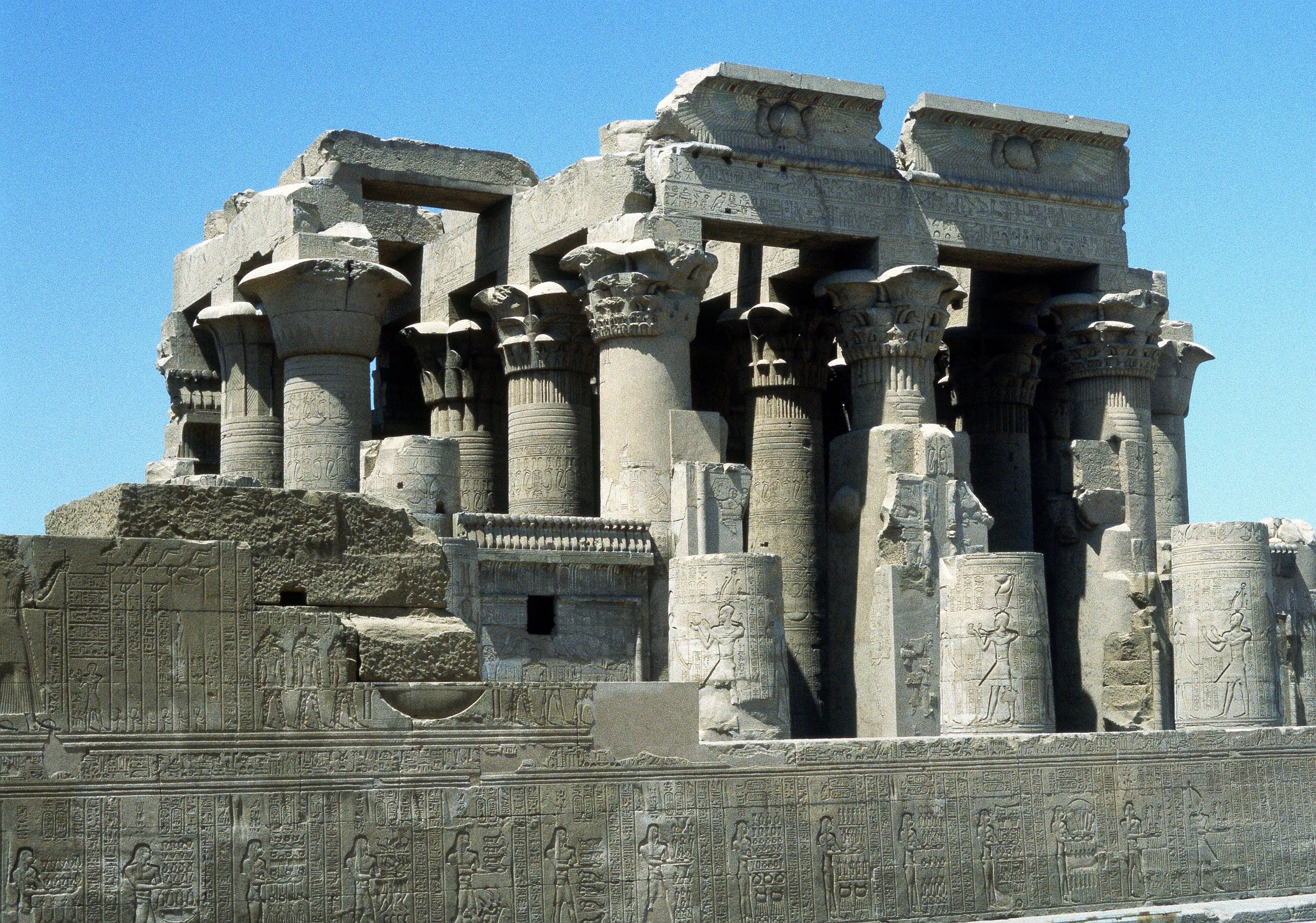 Ancient Egyptian temple columns with hieroglyphics.