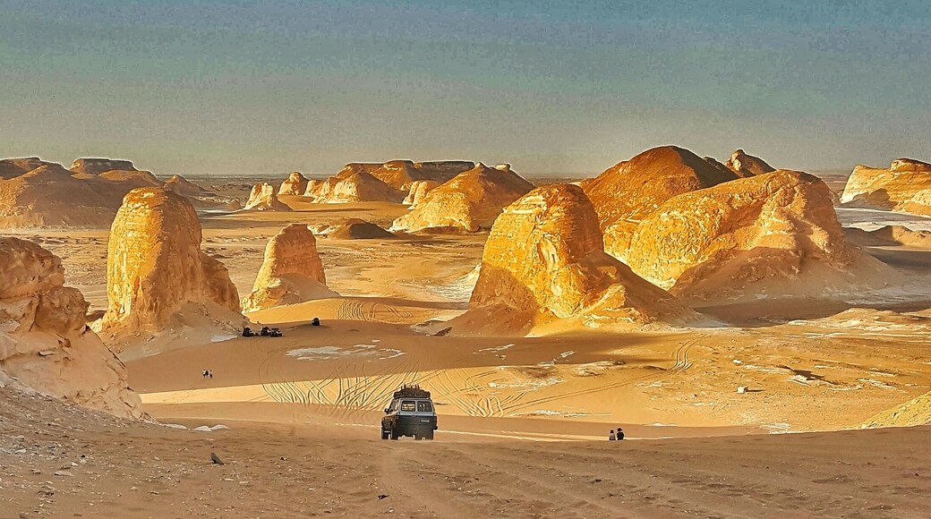 Sunset light simply paints the calcite/lime rocks golden hue from white.
The huge rocks look out of the world
