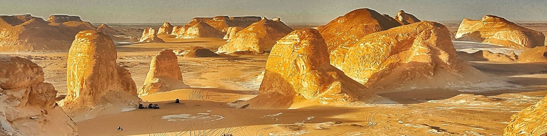 Sunset light simply paints the calcite/lime rocks golden hue from white.
The huge rocks look out of the world