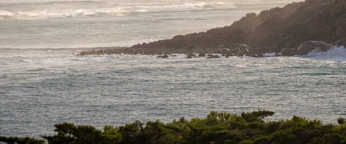 The Bluff featuring rugged coastline, a sunset and general coastal views