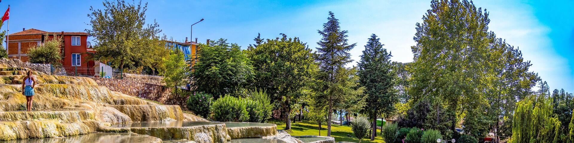 Red thermal springs terraces in Karahayit not far from Pamukkale resort, Karahayit, Denizl, Turkey
