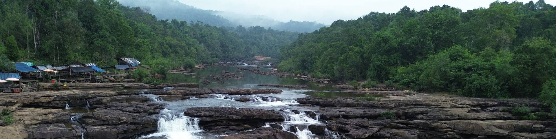 Aerial view of majestic Tatai Waterfall in Koh Kong Province surrounded by dense jungle, Cambodia