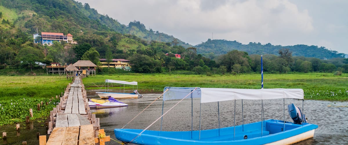 Wooden piers and boats at lake Yojoa, Honduras