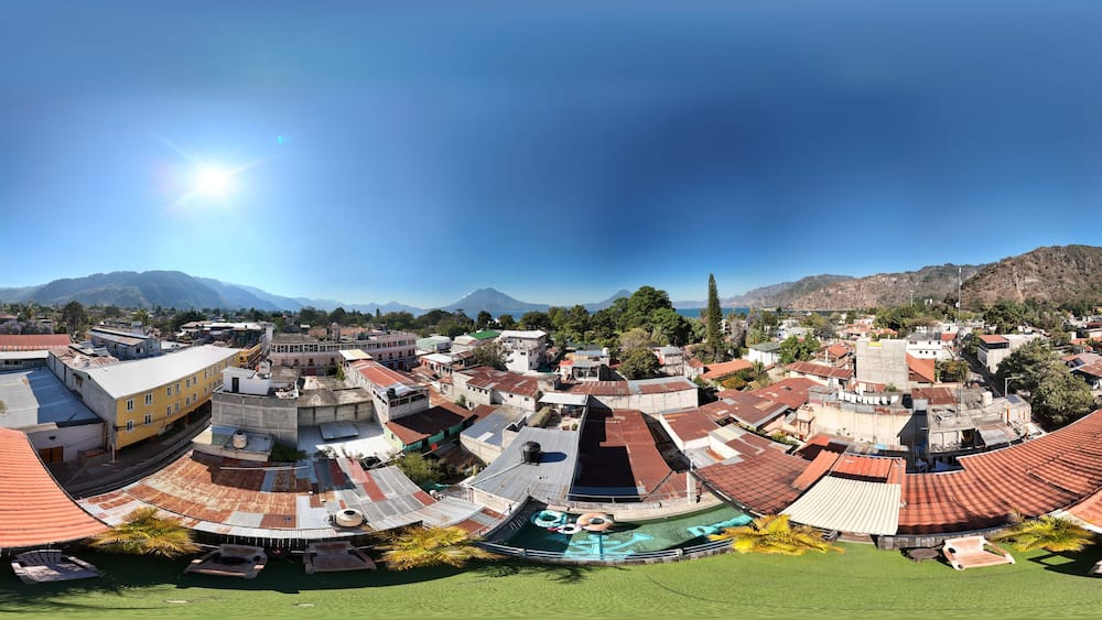 360 aerial photo taken with drone of rooftop terrace overlooking Lake Atitlán in Panajachel, Guatemala