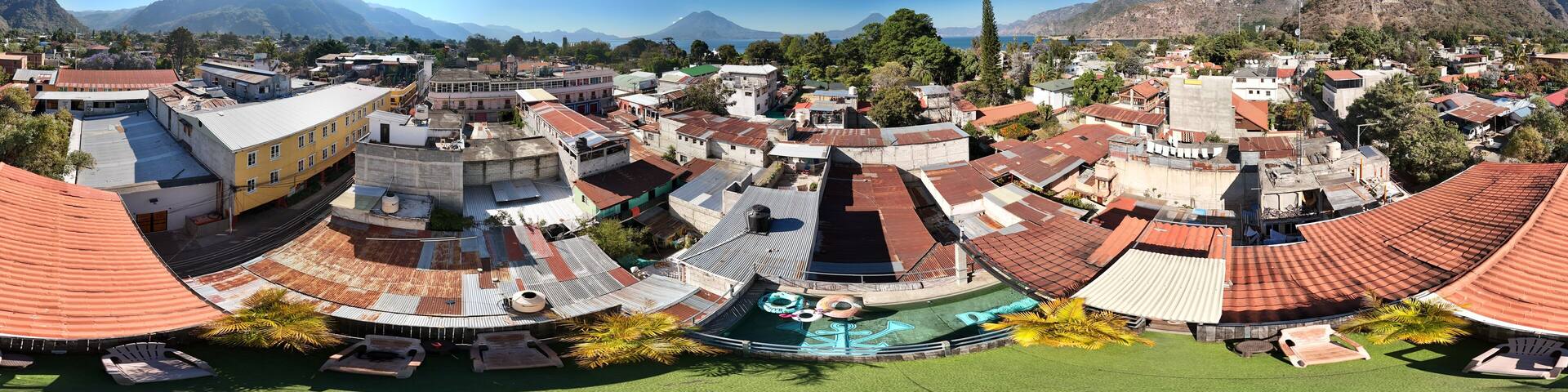 360 aerial photo taken with drone of rooftop terrace overlooking Lake Atitlán in Panajachel, Guatemala