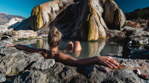 White female bathing in natural hot springs.