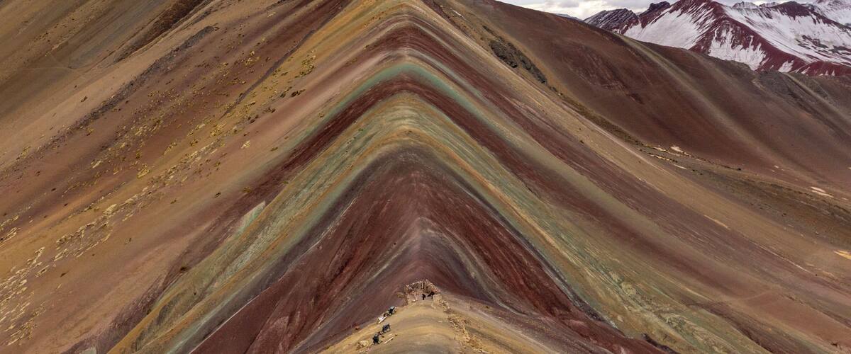 Adventure somewhere over the rainbow. After a 2-day, 17-mile trek around Nevado Ausangate we arrived at Vinicunca, also known as Montaña de Siete Colores, or Rainbow Mountain. This mountain sits a little over 16,000 feet and was only recently discovered after the snow and ice covering the mountain thawed. The rainbow colors are caused by different minerals deposited in the soil. If you plan on taking an adventure to this location, a few days of acclimation to higher altitude in Cusco is advised.
#Peru #Adventure #Vinicunca