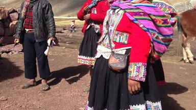 Hidden in a remote corner of Peru's Ausengate region, a 4 hour's drive outside of Cusco and after a good trek, Vinicunca is a remote place frothing with travelers helped by these locals to experience the colored landscapes.