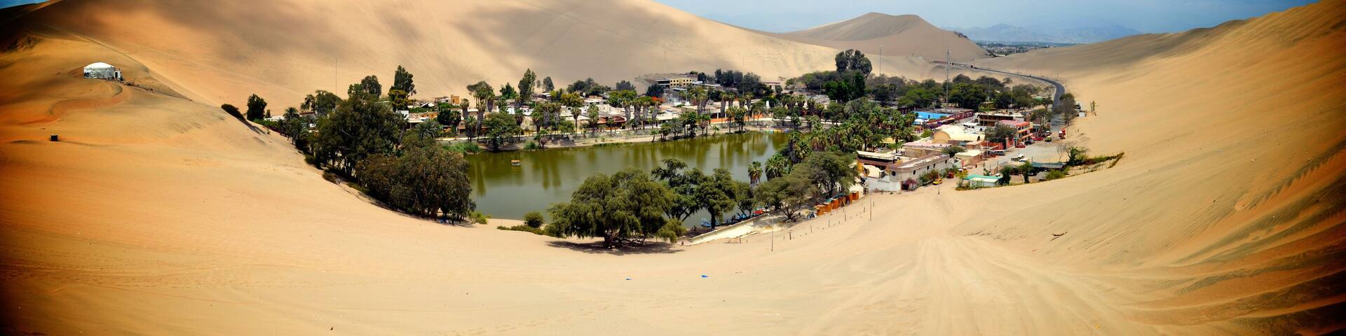 Sand dunes surround the Huacachina oasis, Ica, Peru