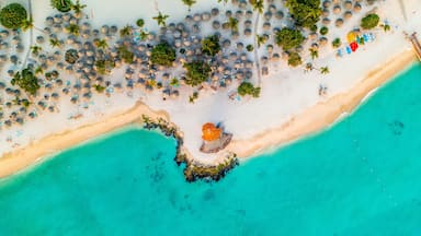 Aerial view of tourists enjoying the warm and crystal clear waters of the Caribbean at Bayahibe beach in San Rafael del Yuma, La Altagracia Province, Dominican Republic