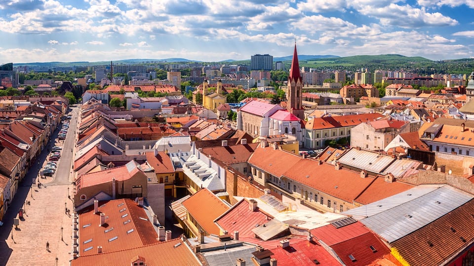 Panoramic view of Kosice Old city from St. Elisabeth Cathedral, scenic daytime cityscape with streets, red tiled roofs of medieval buildings and blue cloudy sky, urban skyline, Slovakia (Slovensko)