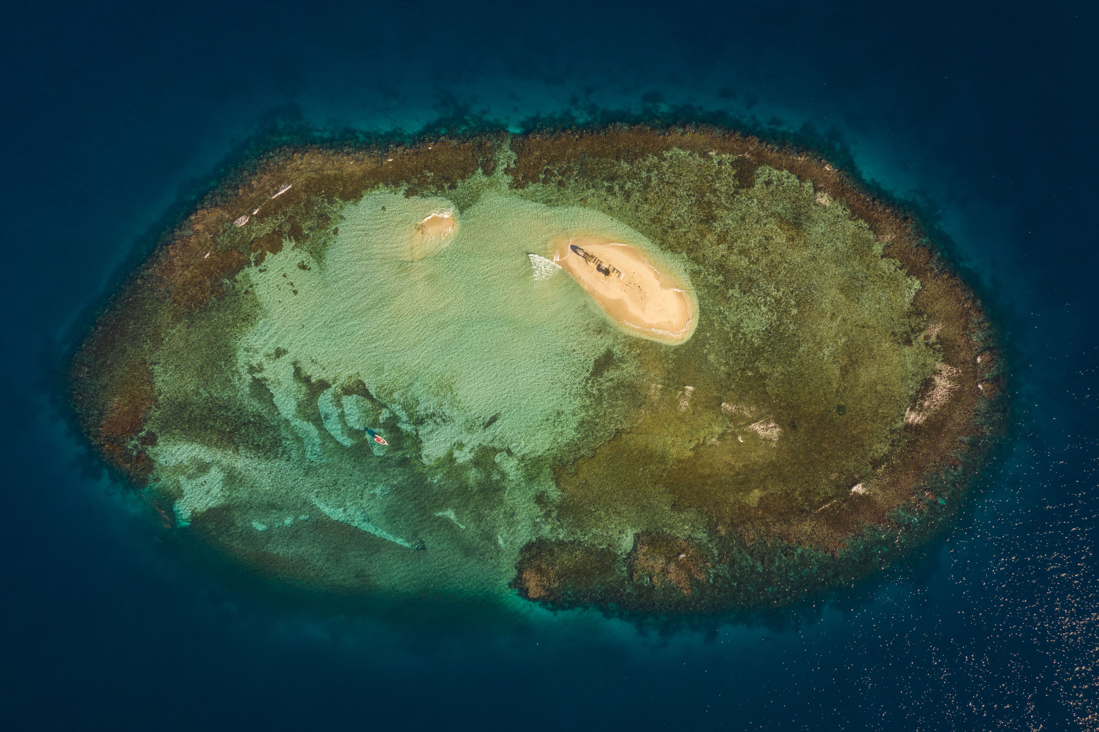 Aerial view of a small isolated wooden hut on the little island of Cayo Arena in Guayubin state, Dominican Republic.