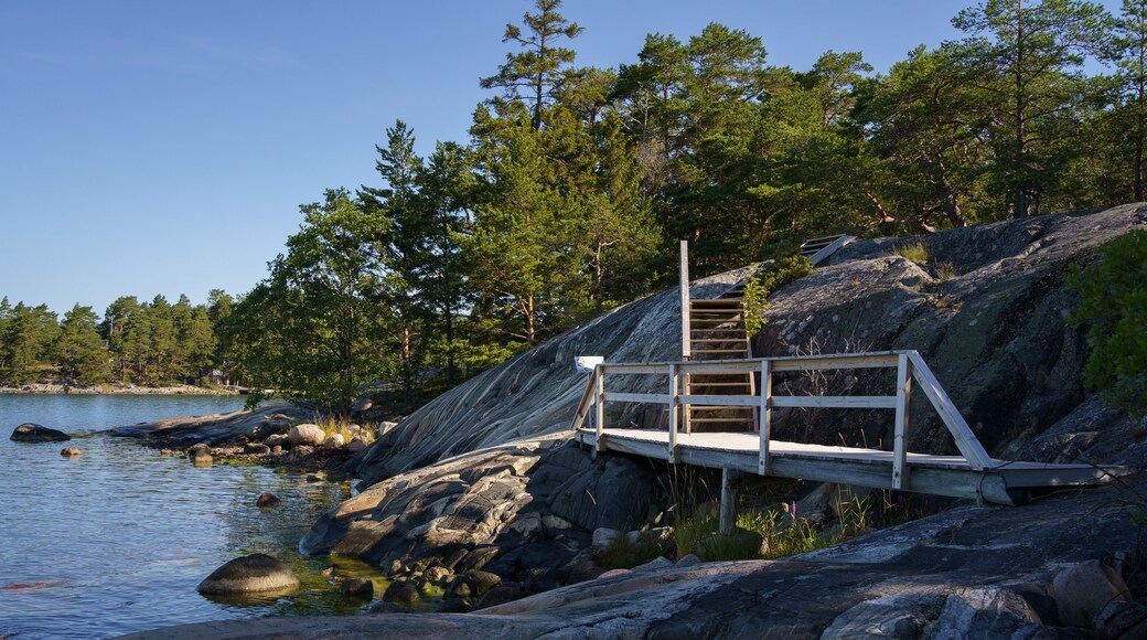 Wooden walkway and stairs on a rocky shore in Kasnäs, Finland