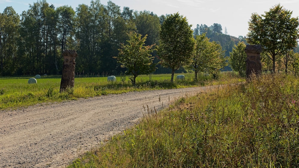 Rural gravel road to Hakoinen Castlehill in summer, Hakoinen, Janakkala, Finland.