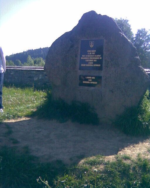 A large rock with a plaque.