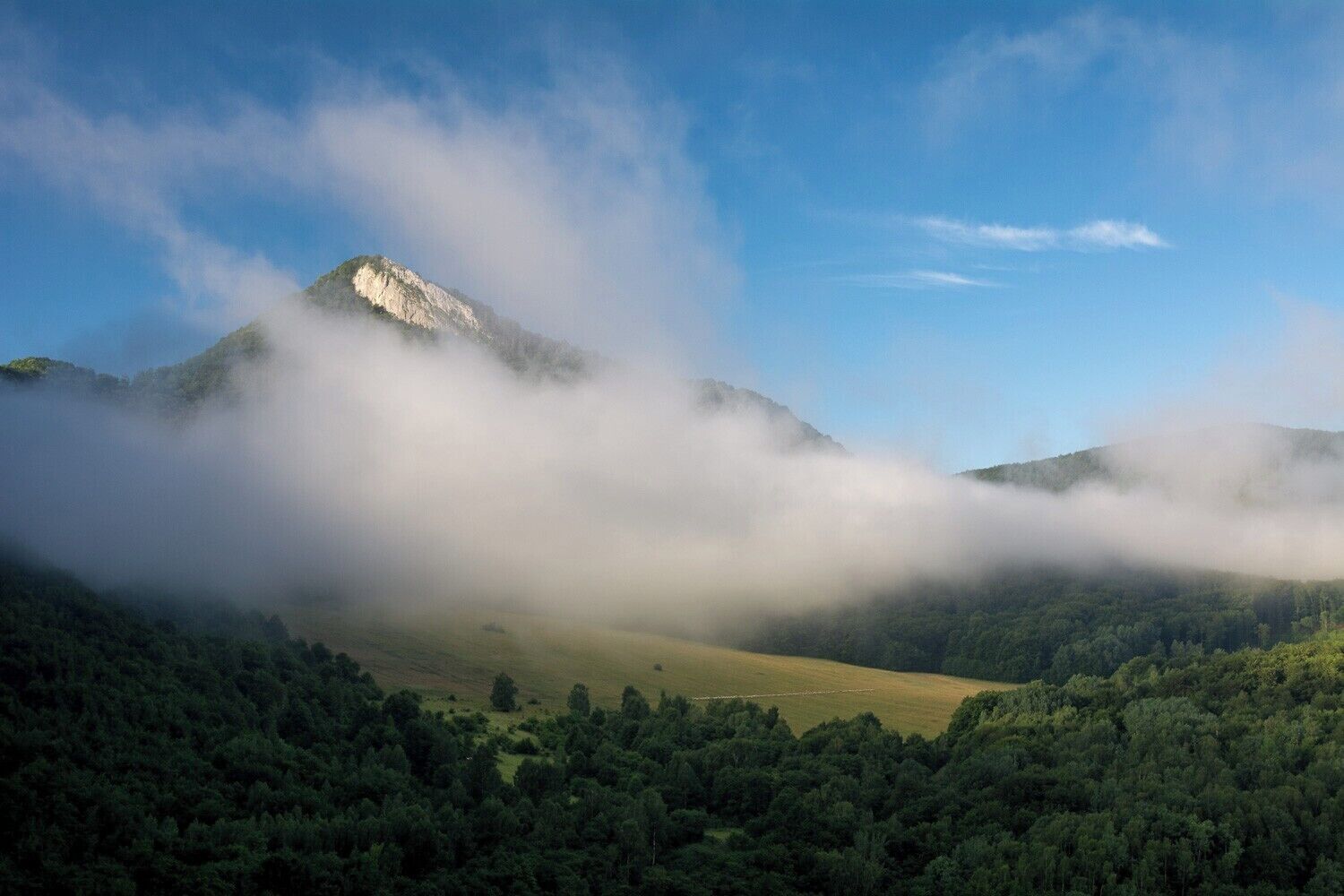 This photo was shot from location called Koňova skala (Horses rock). Theres an awesome view on water reservoir Ruzin and also Sivec which you can see at the photo. 
I recommend you to visit this place at morning  as the light hits the limestone of Sivec :) 

#BvSApplication #BVSBlue