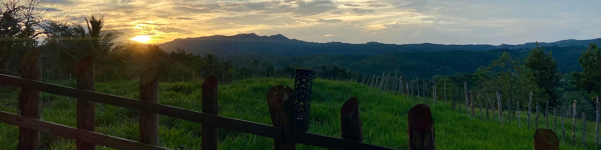 Sunset over fence. Sabana Grande de Boya, Dominican Republic