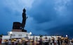 Visakabucha day Candle light trails of people walking around the big buddha