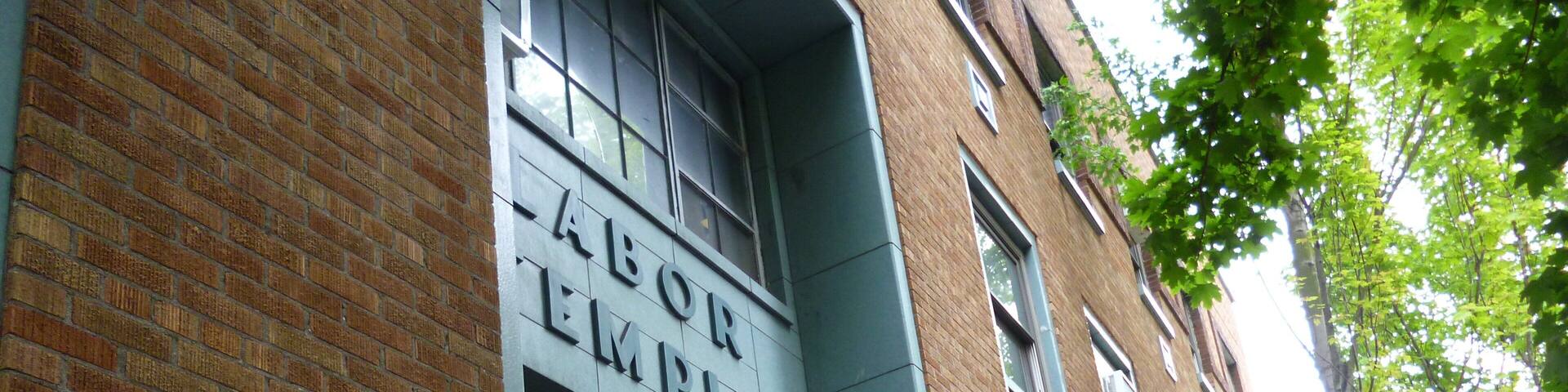 A brick building with a sign that reads "Labor Temple".