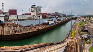 GATUN, PANAMA - MAY 29, 2016: Container ship Cosco Boston is passing through Gatun Locks, part of Panama Canal.