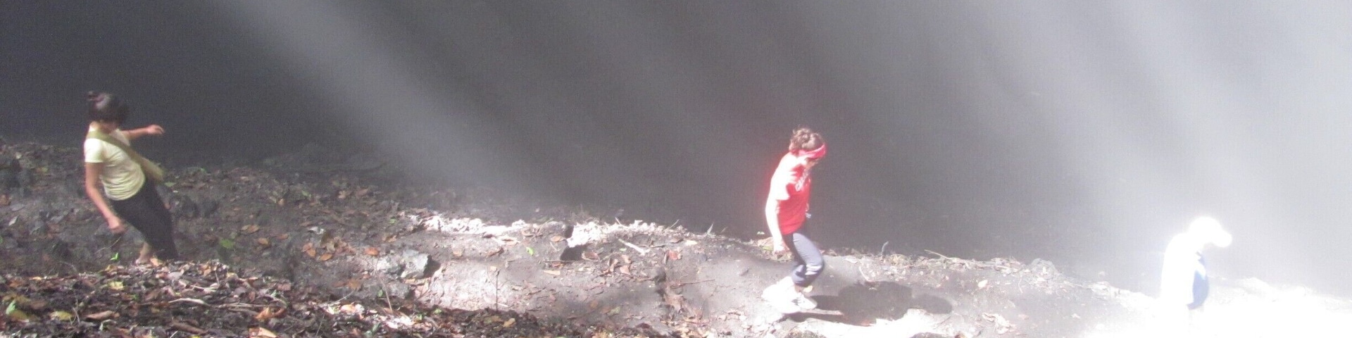 Going down into a sinkhole where it becomes nearly pitch black at the bottom. This sinkhole epitomizes light and darkness and beauty and is thought to have spiritual significance by the locals.