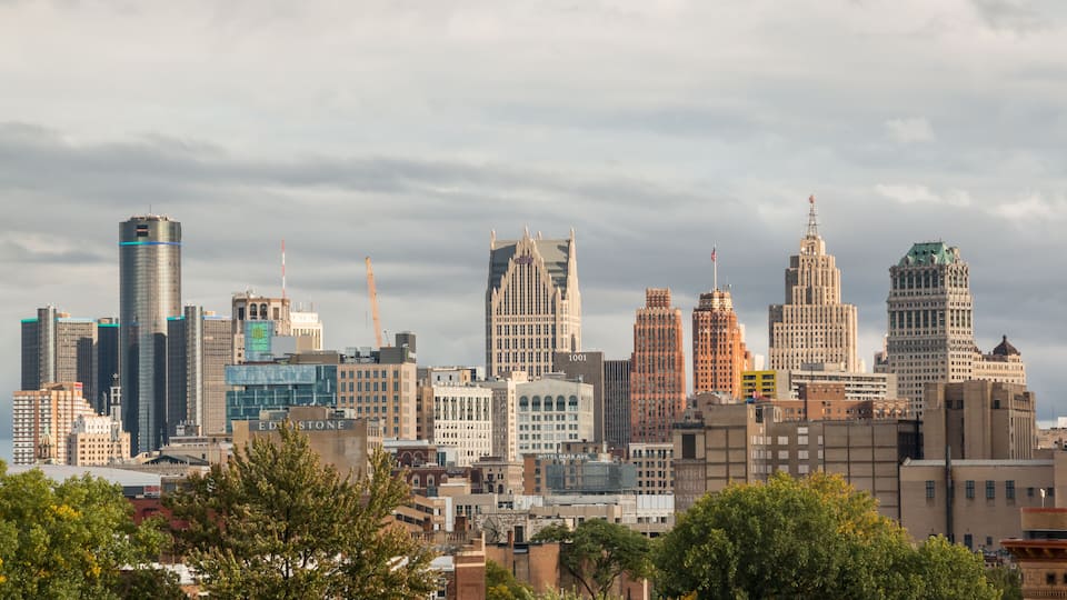 View of landmark downtown Detroit, Michigan skyline as seen from the Cass corridor midtown area. Shot during a sun and clouds mixed afternoon. September 2022.