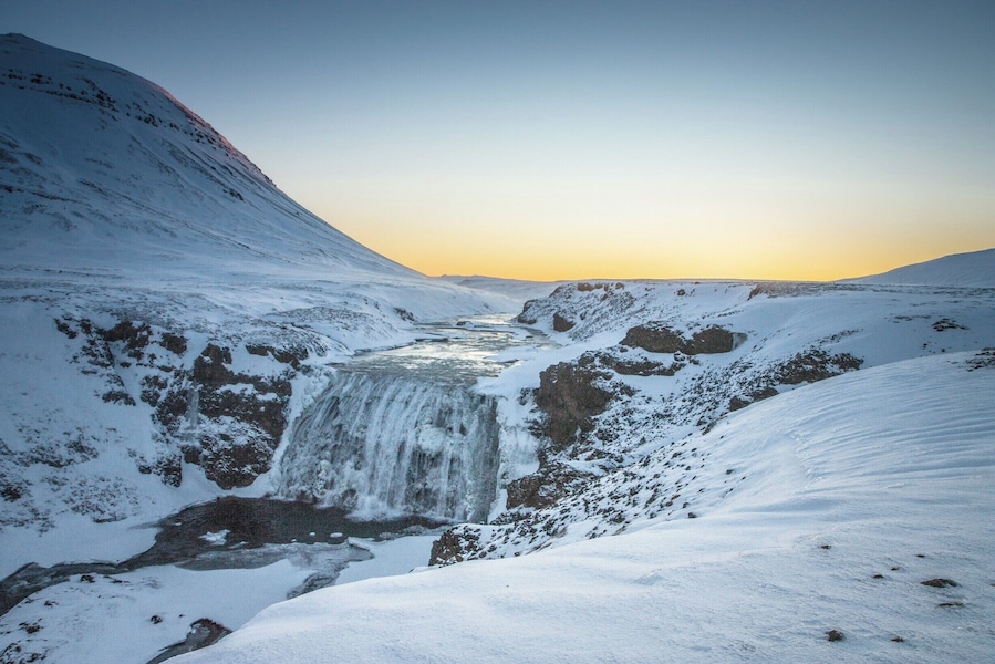 Well worth the short detour off the Golden Circle to þórufoss waterfall... The dawn sky makes it even more beautiful, and the bonus is that, at Christmas time dawn is 11:30am :-)