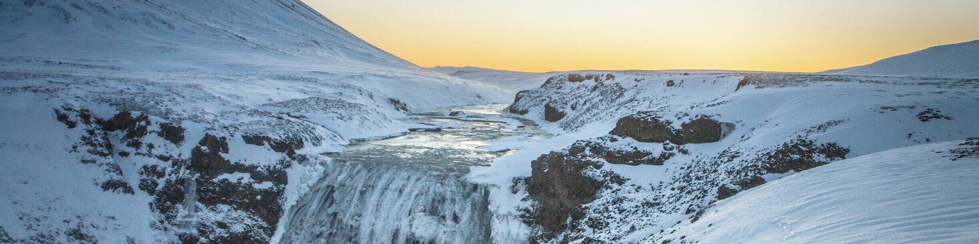 Well worth the short detour off the Golden Circle to þórufoss waterfall... The dawn sky makes it even more beautiful, and the bonus is that, at Christmas time dawn is 11:30am :-)