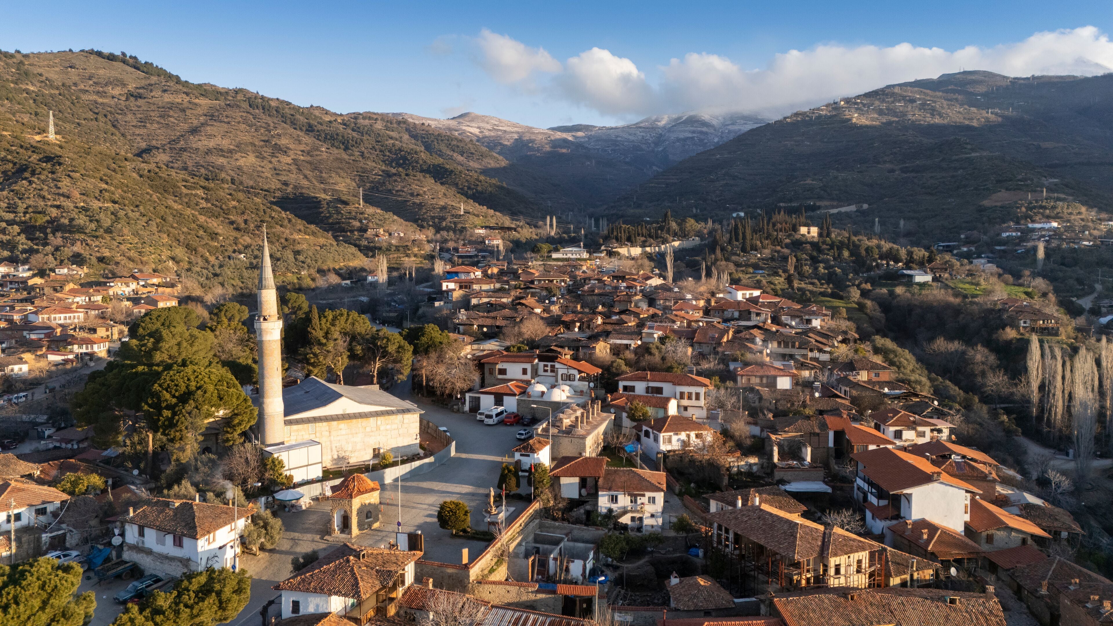 Architecture stone buildings, traditional Turkish village houses in touristic place Birgi, Izmir. Landscape with aerial drone.