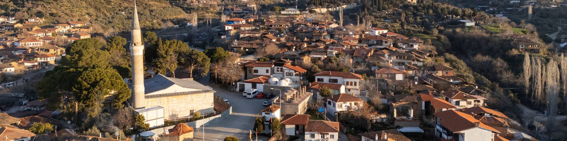 Architecture stone buildings, traditional Turkish village houses in touristic place Birgi, Izmir. Landscape with aerial drone.