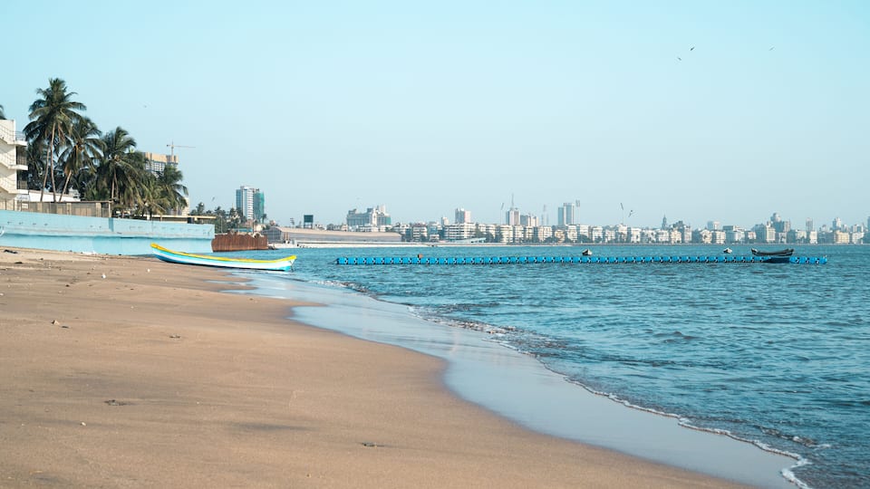 Juhu beach and skyline of Mumbai, India, travel destination in Asia, tropical west coast, Arabian Sea