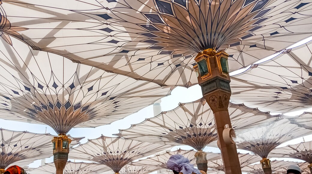 MEDINA, SAUDI ARABIA - APRIL 28 2018: These Umbrella construction on the square of Al-Masjid An-Nabawi or Prophet Muhammed