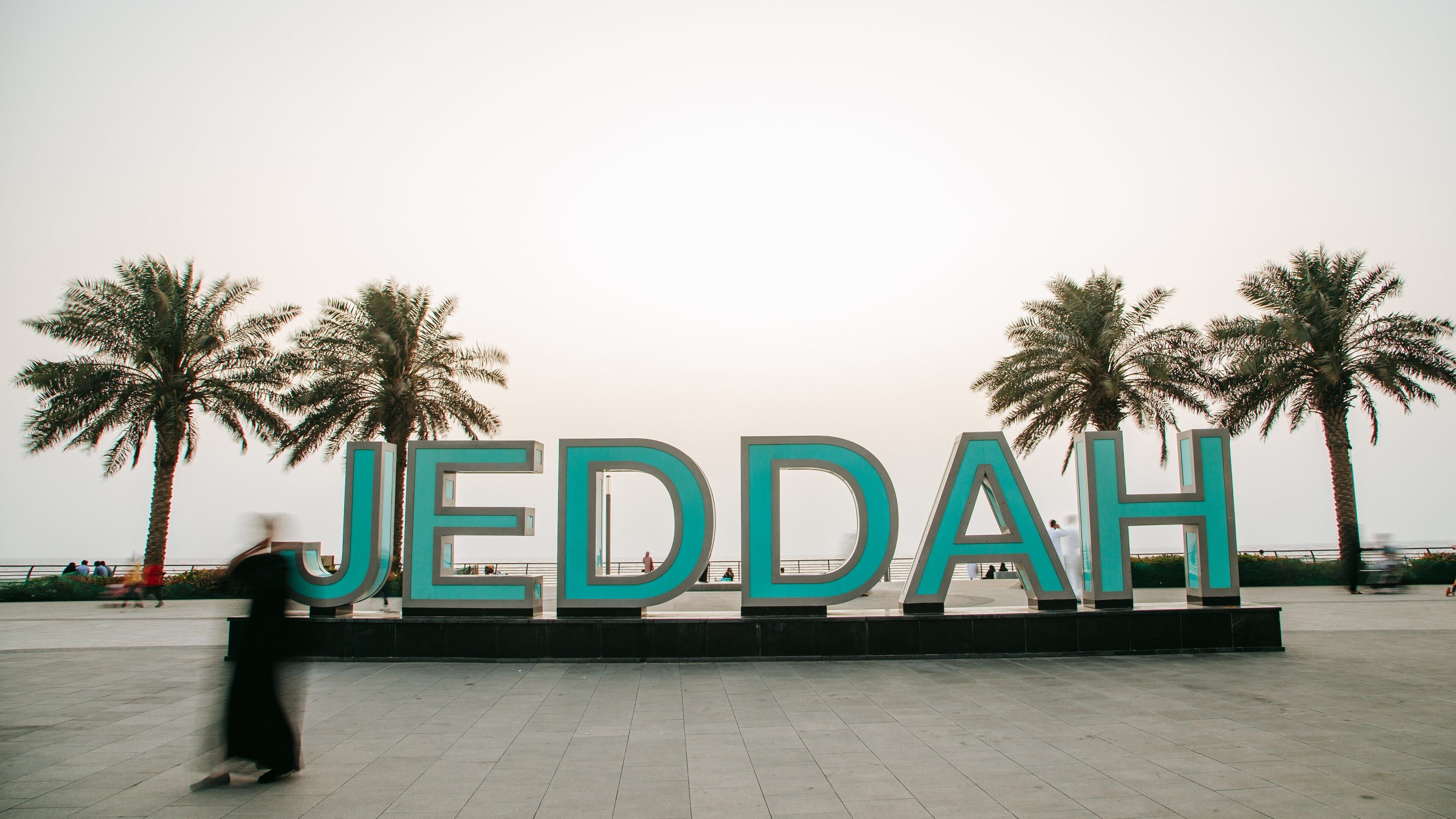 Corniche featuring outdoor art and signage