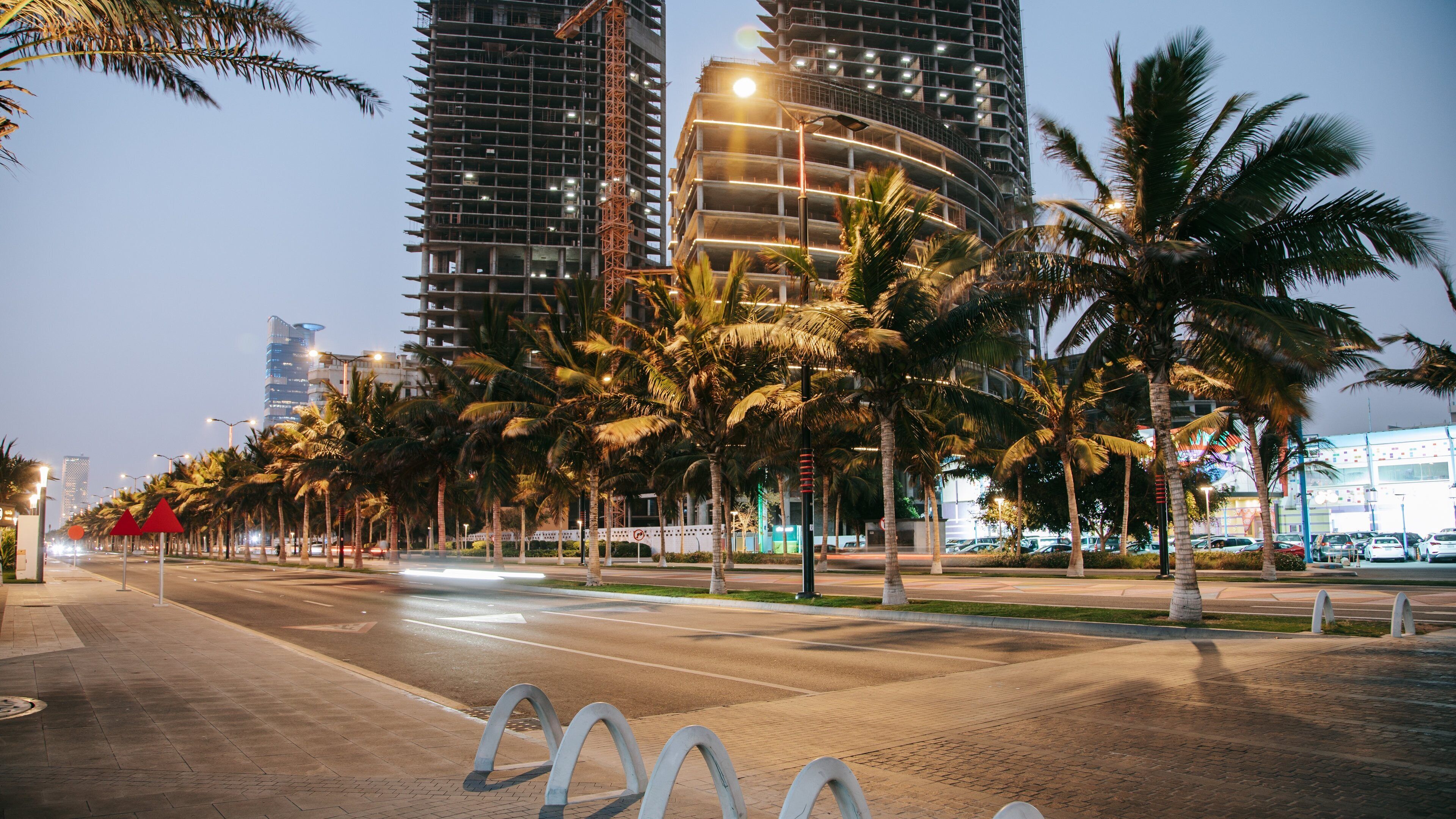 Corniche featuring night scenes and a city