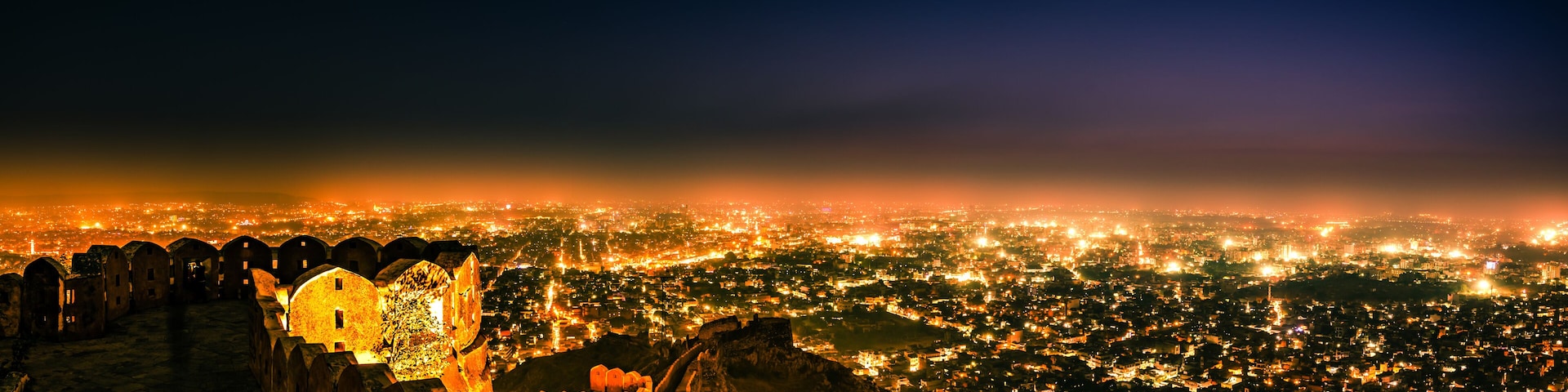 Panoramic aerial view of Jaipur city also known as Pink city during twilight from Nahargarh Fort, Rajasthan, India.