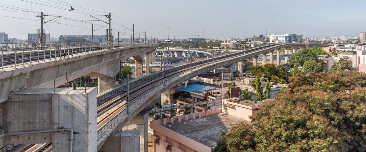 Chennai india may 27 2018 wide view of metro train bridge seen with nearby national highway road (known as kathipaara junction near guindy)