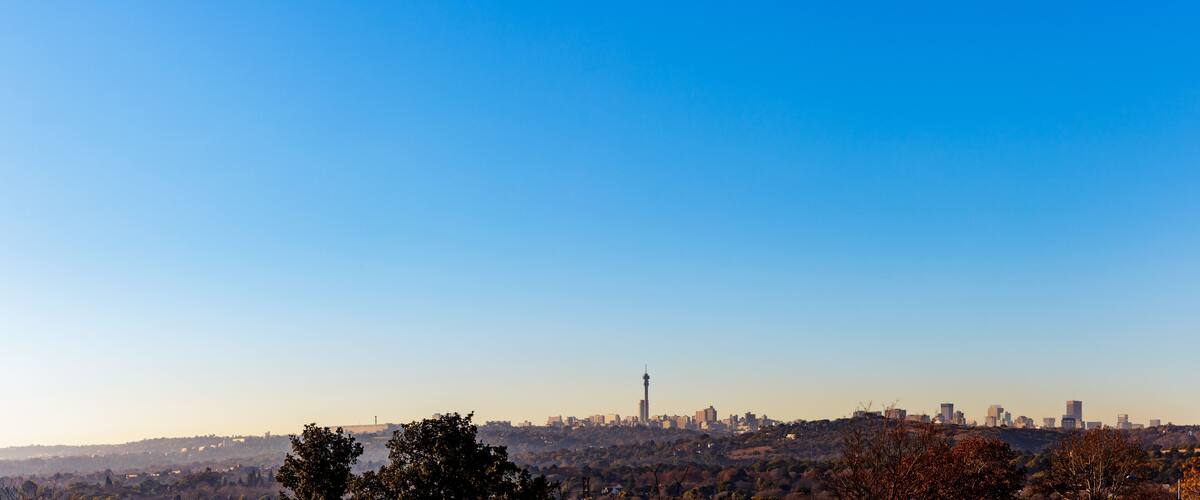 Northcliff view of Johannesburg City Skyline panorama on a winter morning with mist low and clear skies