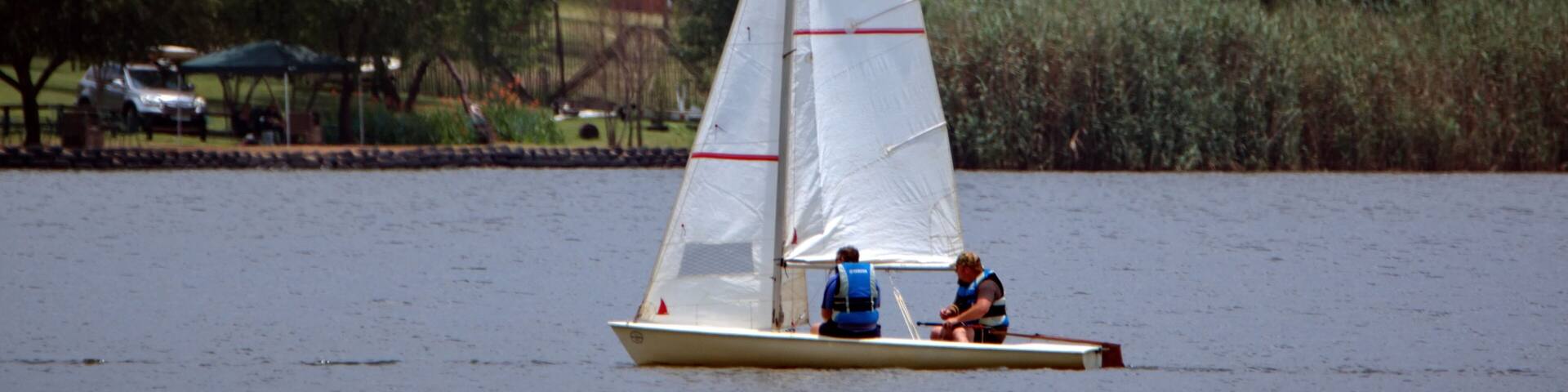Sailboat on a lake at Rietvlei Dam Nature Reserve, Pretoria, South Africa