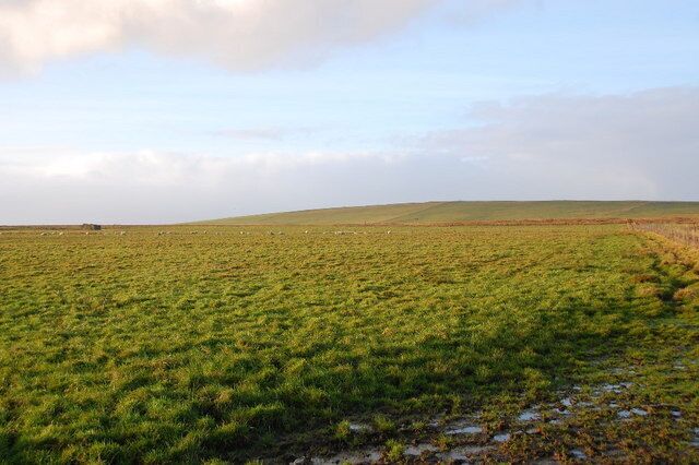 Abandoned crofthouse Looking in a westerly direction over rough grazing. On the skyline to the right of the abandoned crofthouse, can be seen the trig point on Hamly Hill.