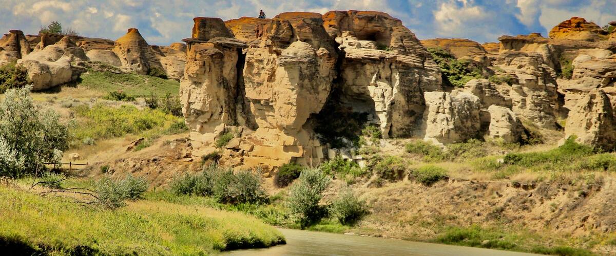 A river flowing through a rocky landscape with prominent sandstone formations.