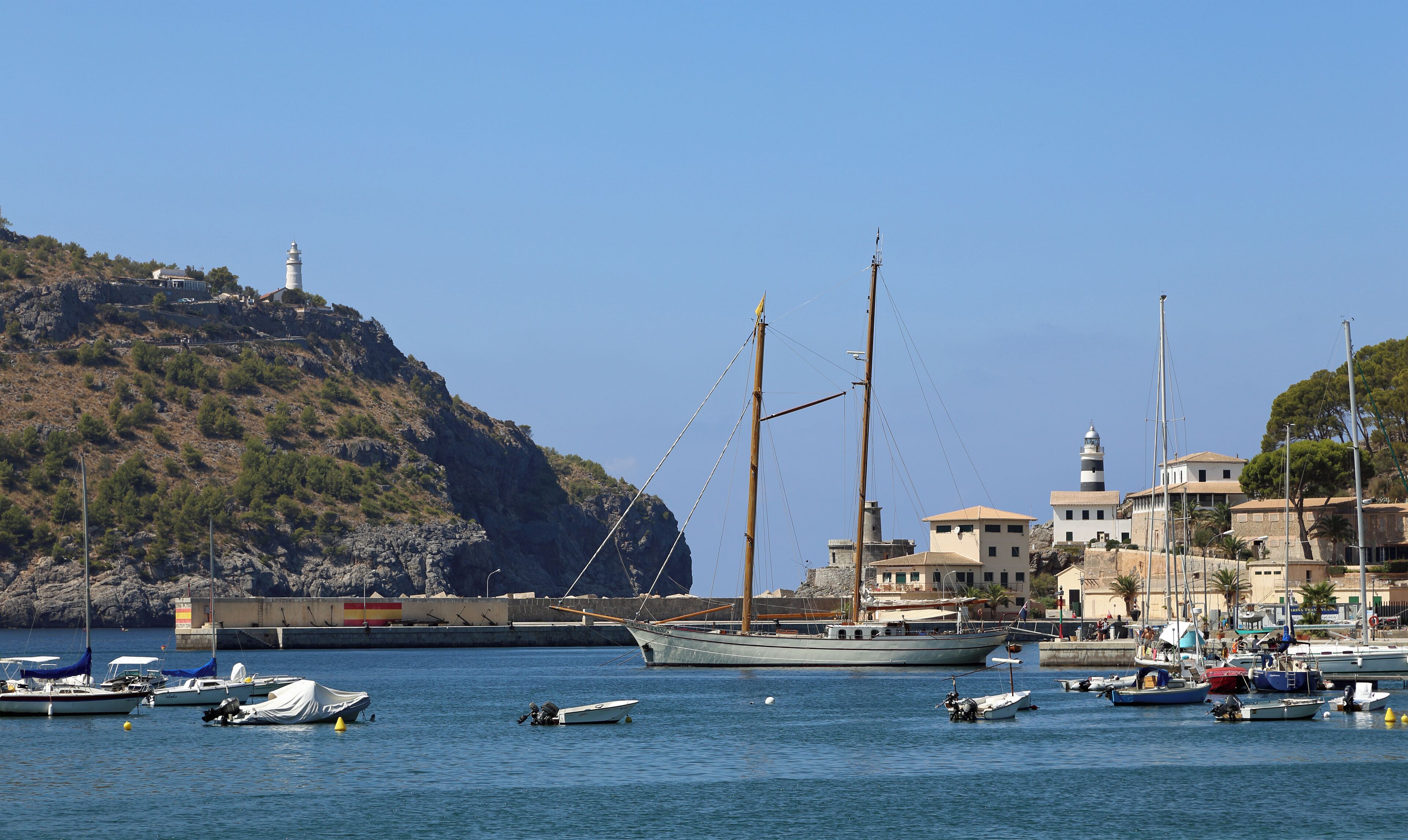 Port de Sóller (Majorca, Spain): the harbour, with at the left the Cap Gros lighthouse and at the right the old and new Sa Creu lighthouses