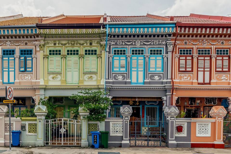 A row of colorful traditional houses with ornate architectural details.