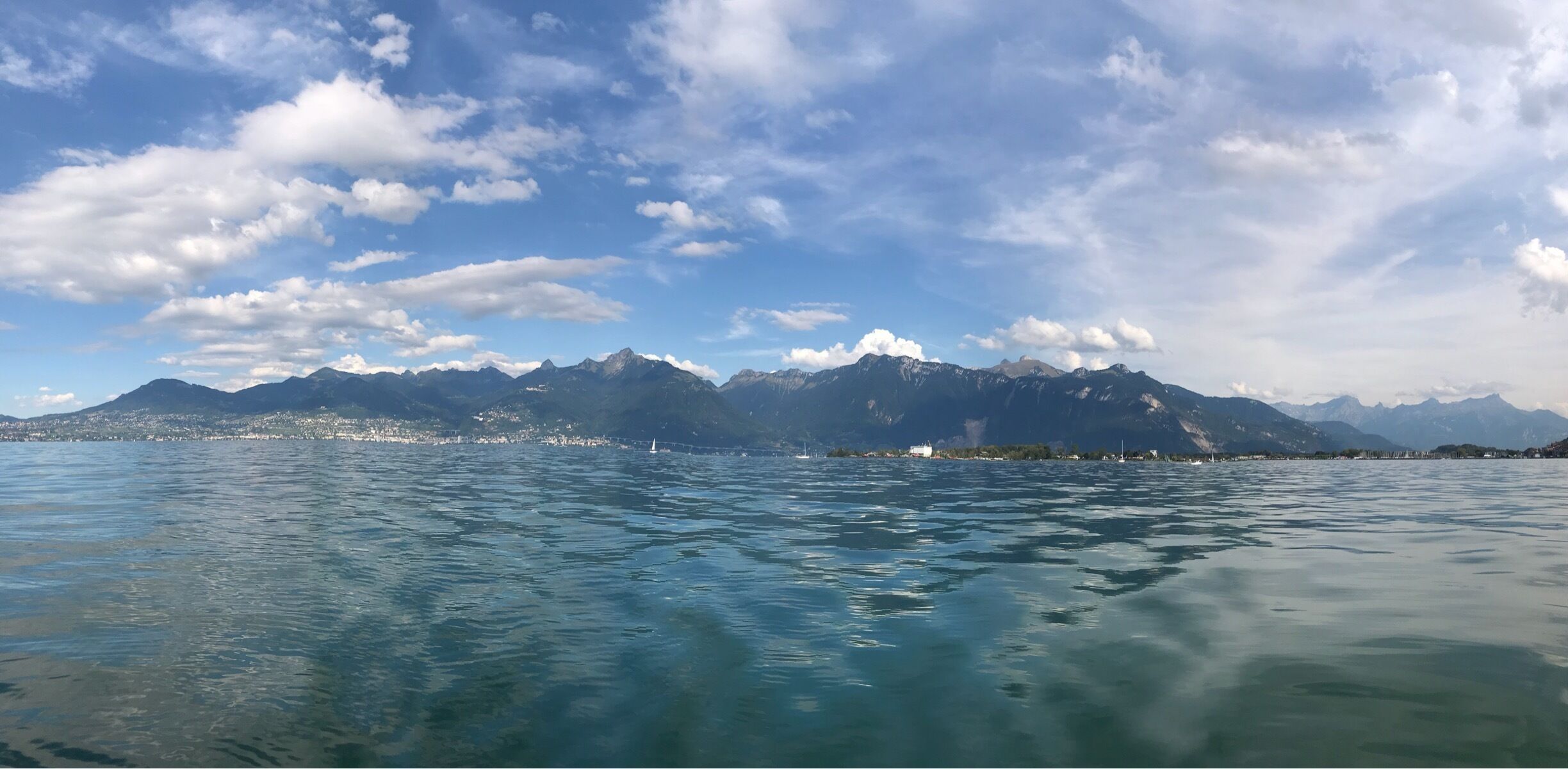 A lake with mountains in the background.