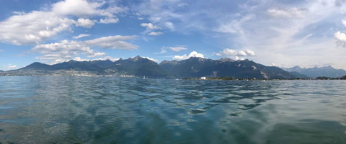 A lake with mountains in the background.