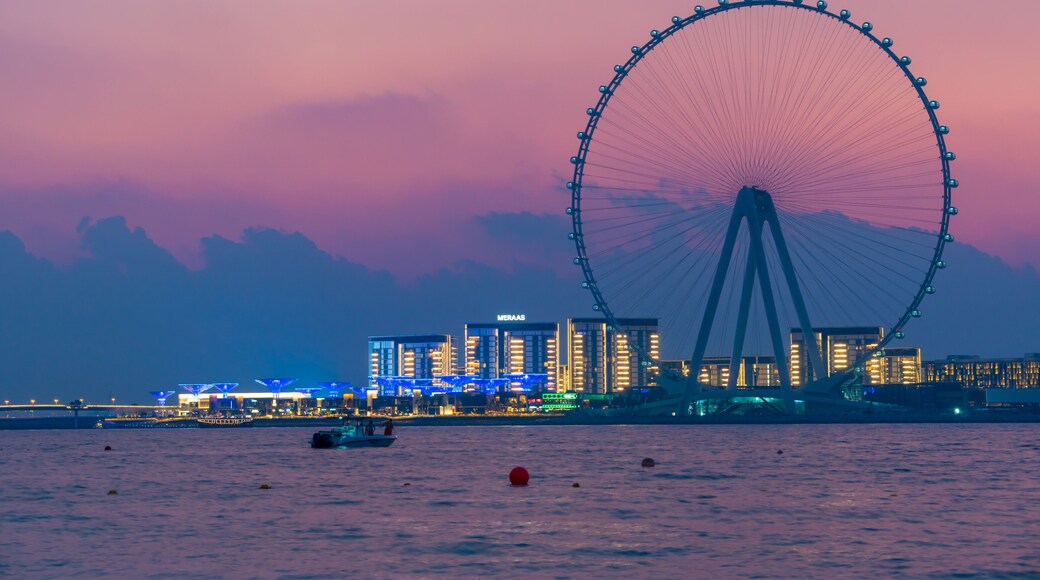 Amazing sunset colors over the sea view to the Ain Dubai, giant Ferris at artificial island Bluewaters Island close to JBR beach. Dubai Eye fits perfect to modern UAE skyline