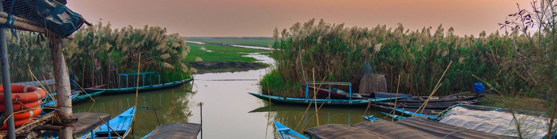 Wooden Boats Anchored at the time of Sunset.