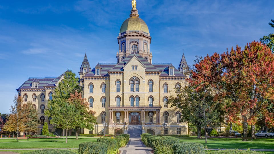 A large, historic building with a prominent dome and arched windows.