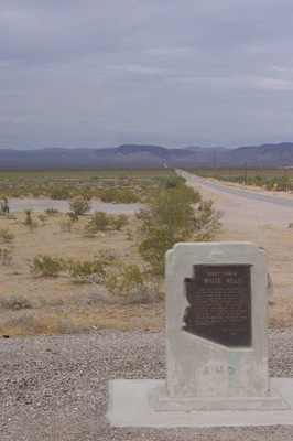 In 1892, Henry Shaffer discovered silver deposits in the area, with the help of local American Indians. The resulting mining efforts led to the creation of the town of White Hills, which reportedly grew to a population of 1,500. The mines consisted of 27 miles (43 km) of tunnels, and a full fifteen mines were being worked within one mile (1.6 km) of the town. In 1894, the White Hills Mining Company was formed to run the operations, but they sold out in 1895 for a price of $1,500,000. The new owners, part of an English company, constructed a 40-stamp mill in the town. However, water had to be piped in from 7 miles (11 km) away, and the supply was never able to meet the mine and mill's demands. Production peaked in 1898, and soon after the mill began operating only half of the time. The town went into decline, and eventually became a ghost tow