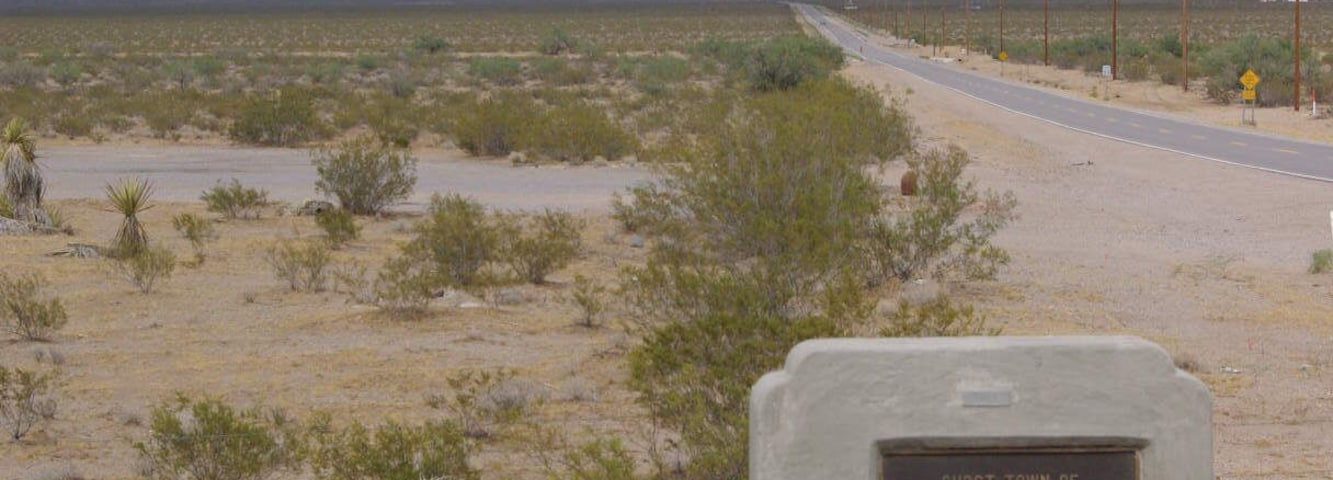 In 1892, Henry Shaffer discovered silver deposits in the area, with the help of local American Indians. The resulting mining efforts led to the creation of the town of White Hills, which reportedly grew to a population of 1,500. The mines consisted of 27 miles (43 km) of tunnels, and a full fifteen mines were being worked within one mile (1.6 km) of the town. In 1894, the White Hills Mining Company was formed to run the operations, but they sold out in 1895 for a price of $1,500,000. The new owners, part of an English company, constructed a 40-stamp mill in the town. However, water had to be piped in from 7 miles (11 km) away, and the supply was never able to meet the mine and mill's demands. Production peaked in 1898, and soon after the mill began operating only half of the time. The town went into decline, and eventually became a ghost tow